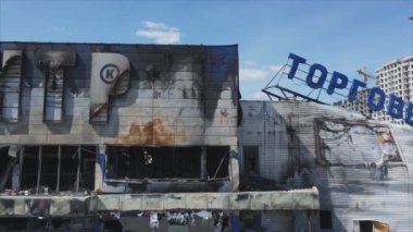 This stock video shows a destroyed building of a shopping center in Bucha, Ukraine during the war in 8K resolution