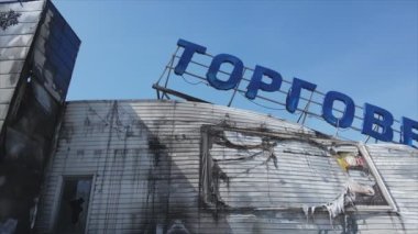 This stock video shows a destroyed building of a shopping center in Bucha, Ukraine during the war in 8K resolution