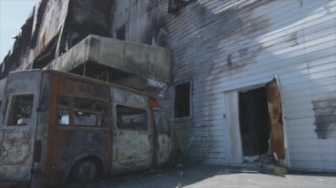 This stock video shows a destroyed building of a shopping center in Bucha, Ukraine during the war in 8K resolution