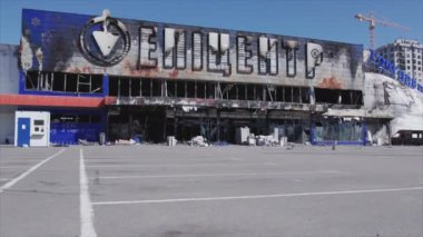 This stock video shows a destroyed building of a shopping center in Bucha, Ukraine during the war in 8K resolution