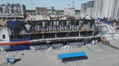 This stock video shows a destroyed building of a shopping center in Bucha, Ukraine during the war in 8K resolution