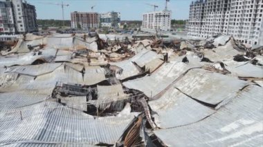 This stock video shows a destroyed building of a shopping center in Bucha, Ukraine during the war in 8K resolution