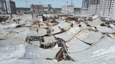 This stock video shows a destroyed building of a shopping center in Bucha, Ukraine during the war in 8K resolution