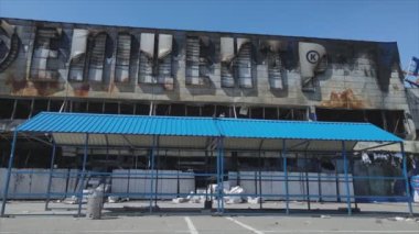 This stock video shows a destroyed building of a shopping center in Bucha, Ukraine during the war in 8K resolution