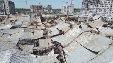 This stock video shows a destroyed building of a shopping center in Bucha, Ukraine during the war in 8K resolution