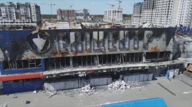 This stock video shows a destroyed building of a shopping center in Bucha, Ukraine during the war in 8K resolution