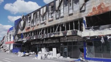 This stock video shows a destroyed building of a shopping center in Bucha, Ukraine during the war in 8K resolution