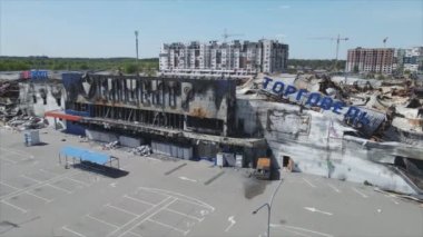 This stock video shows a destroyed building of a shopping center in Bucha, Ukraine during the war in 8K resolution