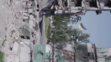 This stock vertical video shows the aftermath of the war in Ukraine - a destroyed residential building in Borodyanka, grey, flat video