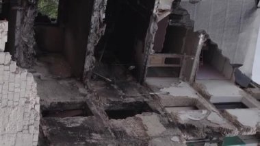 This stock vertical video shows the aftermath of the war in Ukraine - a destroyed residential building in Borodyanka, grey, flat video