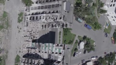 This stock vertical video shows the aftermath of the war in Ukraine - a destroyed residential building in Borodyanka, grey, flat video