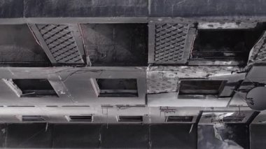 This stock vertical video shows the aftermath of the war in Ukraine - a destroyed residential building in Borodyanka, grey, flat video