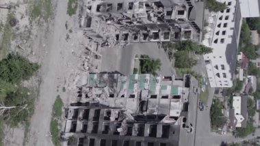 This stock vertical video shows the aftermath of the war in Ukraine - a destroyed residential building in Borodyanka, grey, flat video