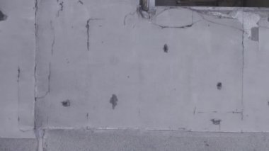 This stock vertical video shows the aftermath of the war in Ukraine - a destroyed residential building in Borodyanka, grey, flat video