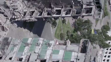 This stock vertical video shows the aftermath of the war in Ukraine - a destroyed residential building in Borodyanka, grey, flat video