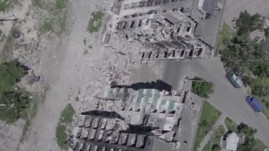 This stock vertical video shows the aftermath of the war in Ukraine - a destroyed residential building in Borodyanka, grey, flat video