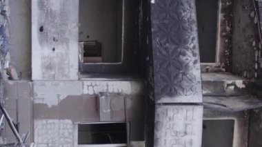 This stock vertical video shows the aftermath of the war in Ukraine - a destroyed residential building in Borodyanka, grey, flat video