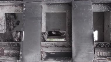 This stock vertical video shows the aftermath of the war in Ukraine - a destroyed residential building in Borodyanka, grey, flat video