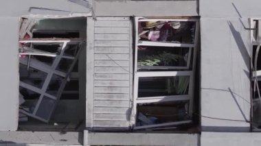This stock vertical video shows the aftermath of the war in Ukraine - a destroyed residential building in Borodyanka, grey, flat video