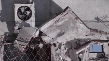 This stock vertical video shows the aftermath of the war in Ukraine - a destroyed residential building in Borodyanka, grey, flat video