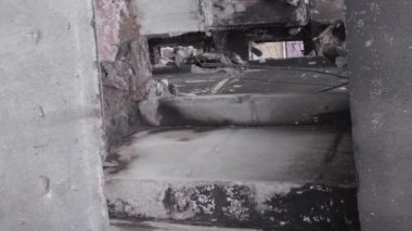 This stock vertical video shows the aftermath of the war in Ukraine - a destroyed residential building in Borodyanka, grey, flat video