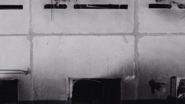 This stock vertical video shows the aftermath of the war in Ukraine - a destroyed residential building in Borodyanka, grey, flat video