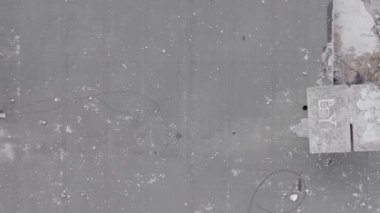 This stock vertical video shows the aftermath of the war in Ukraine - a destroyed residential building in Borodyanka, grey, flat video