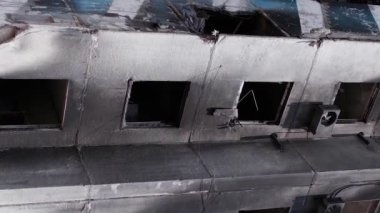 This stock vertical video shows the aftermath of the war in Ukraine - a destroyed residential building in Borodyanka, grey, flat video