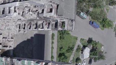 This stock vertical video shows the aftermath of the war in Ukraine - a destroyed residential building in Borodyanka, grey, flat video