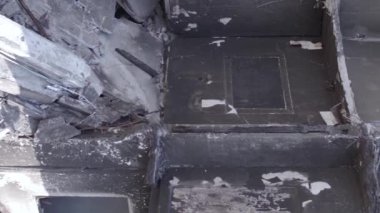 This stock vertical video shows the aftermath of the war in Ukraine - a destroyed residential building in Borodyanka, grey, flat video