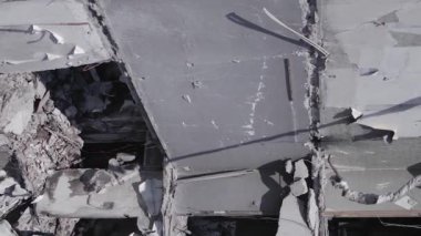 This stock vertical video shows the aftermath of the war in Ukraine - a destroyed residential building in Borodyanka, grey, flat video