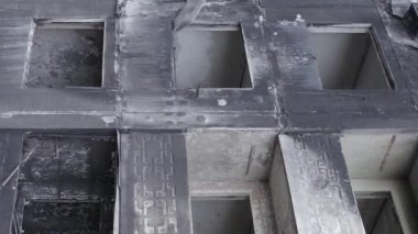 This stock vertical video shows the aftermath of the war in Ukraine - a destroyed residential building in Borodyanka, grey, flat video