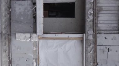 This stock vertical video shows the aftermath of the war in Ukraine - a destroyed residential building in Borodyanka, grey, flat video