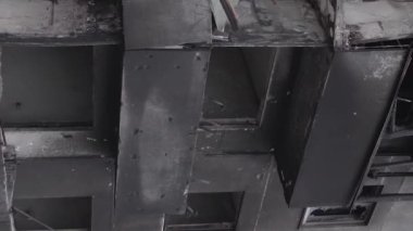 This stock vertical video shows the aftermath of the war in Ukraine - a destroyed residential building in Borodyanka, grey, flat video