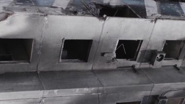 This stock vertical video shows the aftermath of the war in Ukraine - a destroyed residential building in Borodyanka, grey, flat video
