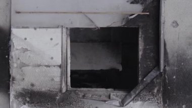 This stock vertical video shows the aftermath of the war in Ukraine - a destroyed residential building in Borodyanka, grey, flat video