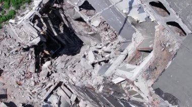 This stock vertical video shows the aftermath of the war in Ukraine - a destroyed residential building in Borodyanka, grey, flat video