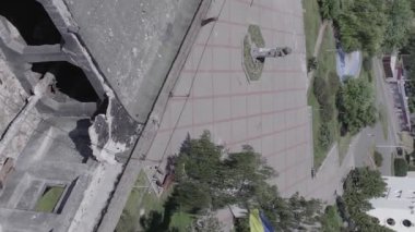 This stock vertical video shows the aftermath of the war in Ukraine - a destroyed residential building in Borodyanka, grey, flat video