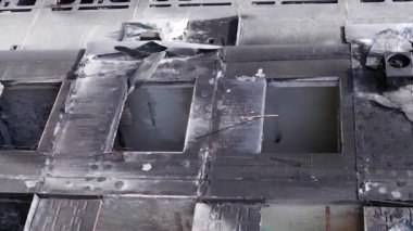 This stock vertical video shows the aftermath of the war in Ukraine - a destroyed residential building in Borodyanka, grey, flat video