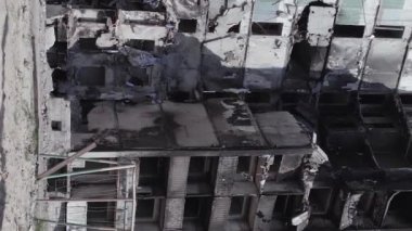 This stock vertical video shows the aftermath of the war in Ukraine - a destroyed residential building in Borodyanka, grey, flat video
