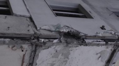 This stock vertical video shows the aftermath of the war in Ukraine - a destroyed residential building in Borodyanka, grey, flat video