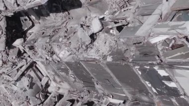 This stock vertical video shows the aftermath of the war in Ukraine - a destroyed residential building in Borodyanka, grey, flat video