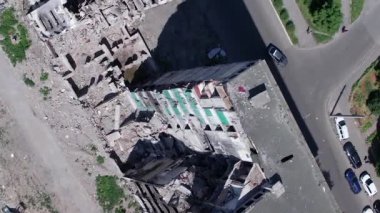This stock vertical video shows the aftermath of the war in Ukraine - a destroyed residential building in Borodyanka, grey, flat video