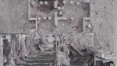 This stock vertical video shows the aftermath of the war in Ukraine - a destroyed residential building in Borodyanka, grey, flat video