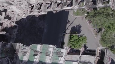 This stock vertical video shows the aftermath of the war in Ukraine - a destroyed residential building in Borodyanka, grey, flat video