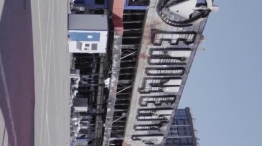 This stock vertical video shows a destroyed building of a shopping center in Bucha during the war in Ukraine, grey, flat video