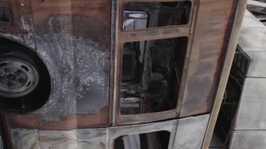 This stock vertical video shows a destroyed building of a shopping center in Bucha during the war in Ukraine, grey, flat video