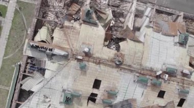 This stock vertical video shows a war-torn building in Stoyanka, Bucha district, Ukraine, flat, grey video