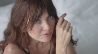 This is a stock video shows a girl in beautiful erotic sexy lingerie in 8K resolution