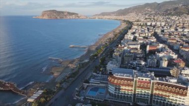 This stock footage shows aerial view of Alanya, Turkey - a resort town on the seashore in 8K resolution